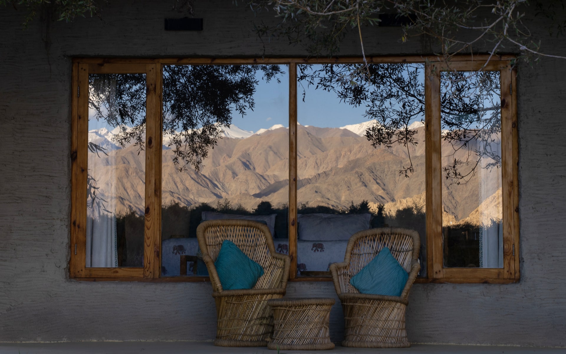 Mountain Reflection on Cabin Window